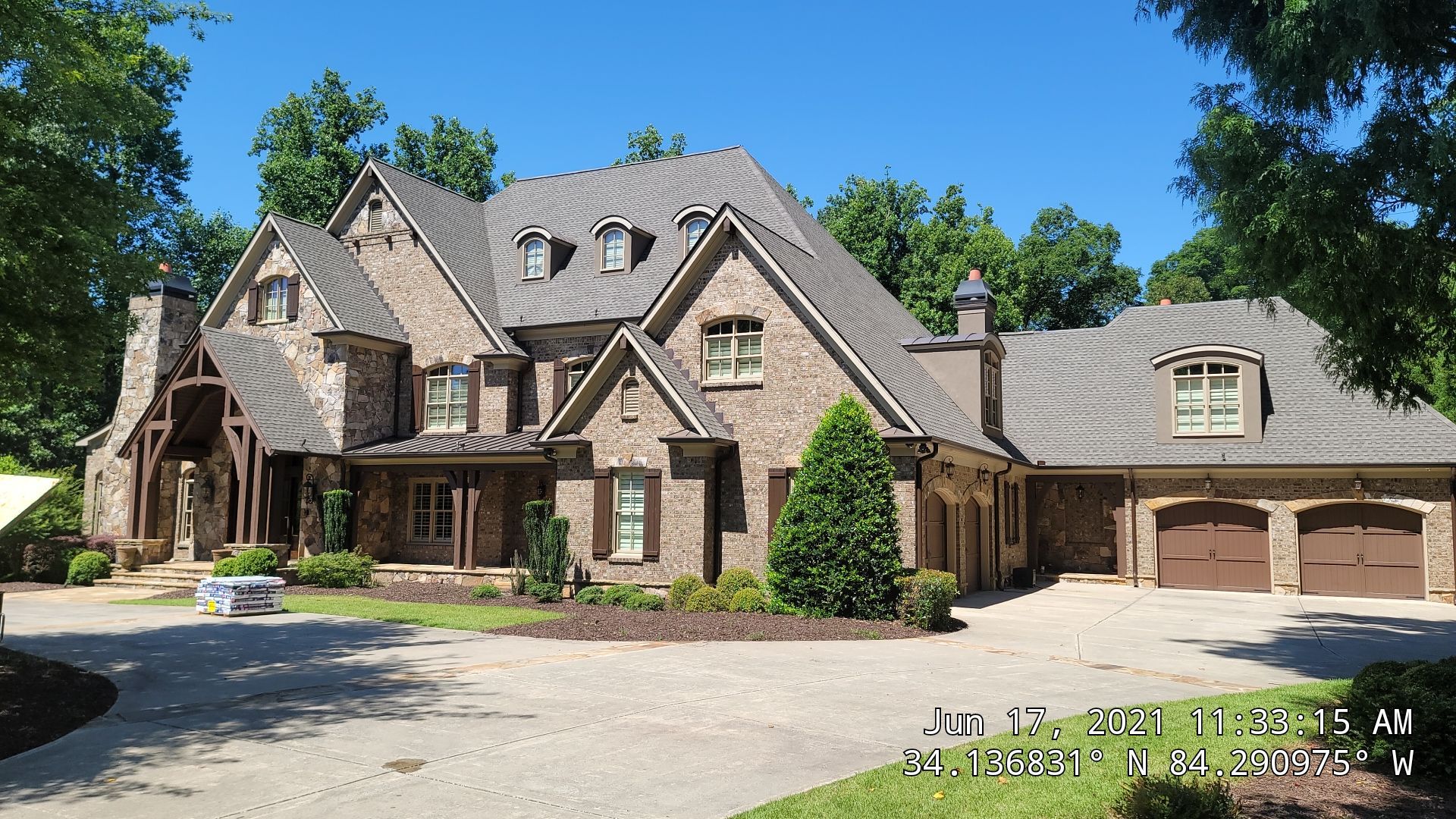 Completed 1 Source Roofing project showing integrated skylight and shingle system on a Georgia home